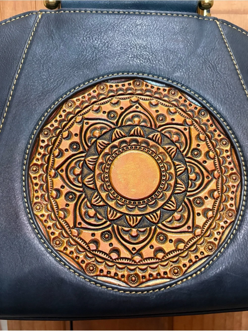 Source Unknown Black Leather Shoulder Bag with Gold Embossed Medallion